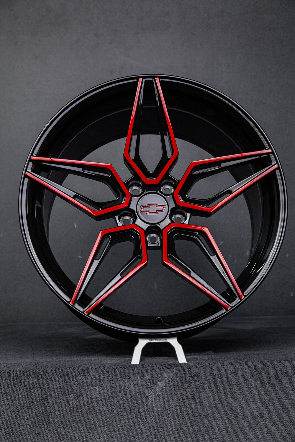 Side profile showing deep concave forged red and black wheels on 2023 Camaro