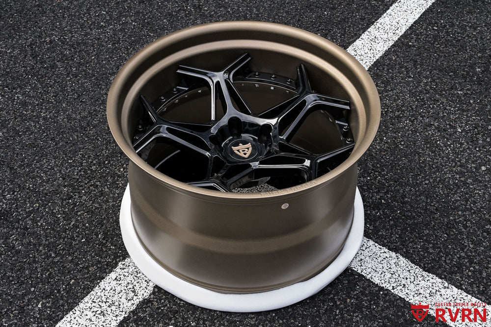 Front three-quarter view of a 2023 Chevrolet Corvette C8 Stingray Z51 on RVRN RV-DR01 2-piece forged Corvette C8 wheels with Y-spoke deep concave design, gloss black spoke and matte bronze barrel, 20x11 front and 21x13 rear.
