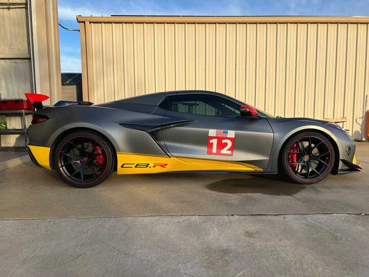 Front angle of custom forged red and black C8 Z06 wheels