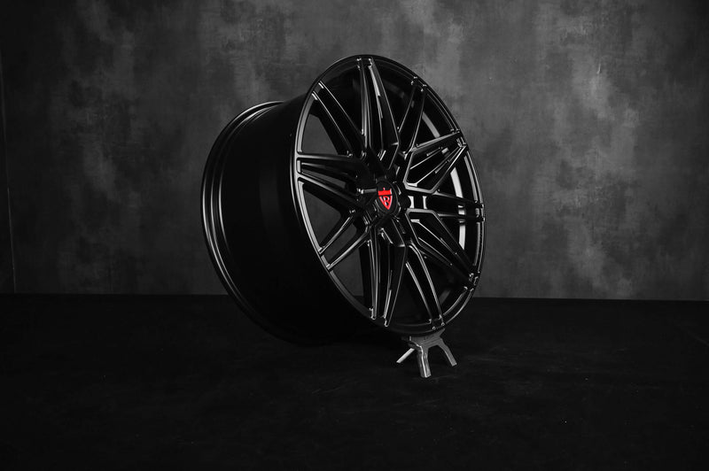 Black custom forged monoblock rim for Tesla Model Y, showcasing a 21-inch staggered design in a sleek style.