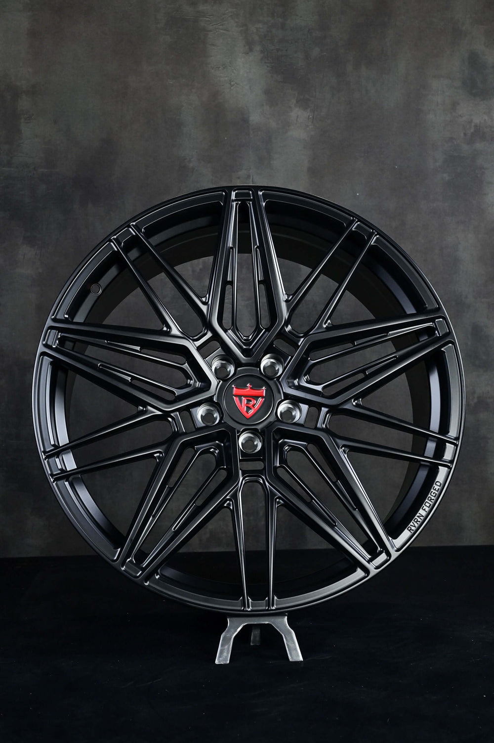 Black custom forged monoblock rims for Tesla Model Y, featuring a unique design and 21-inch staggered profile.