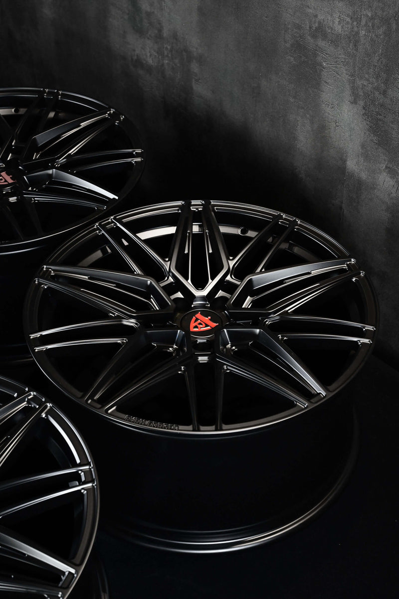 Black custom forged monoblock rims for Tesla Model Y, showcasing 21-inch staggered design and sleek performance aesthetics.