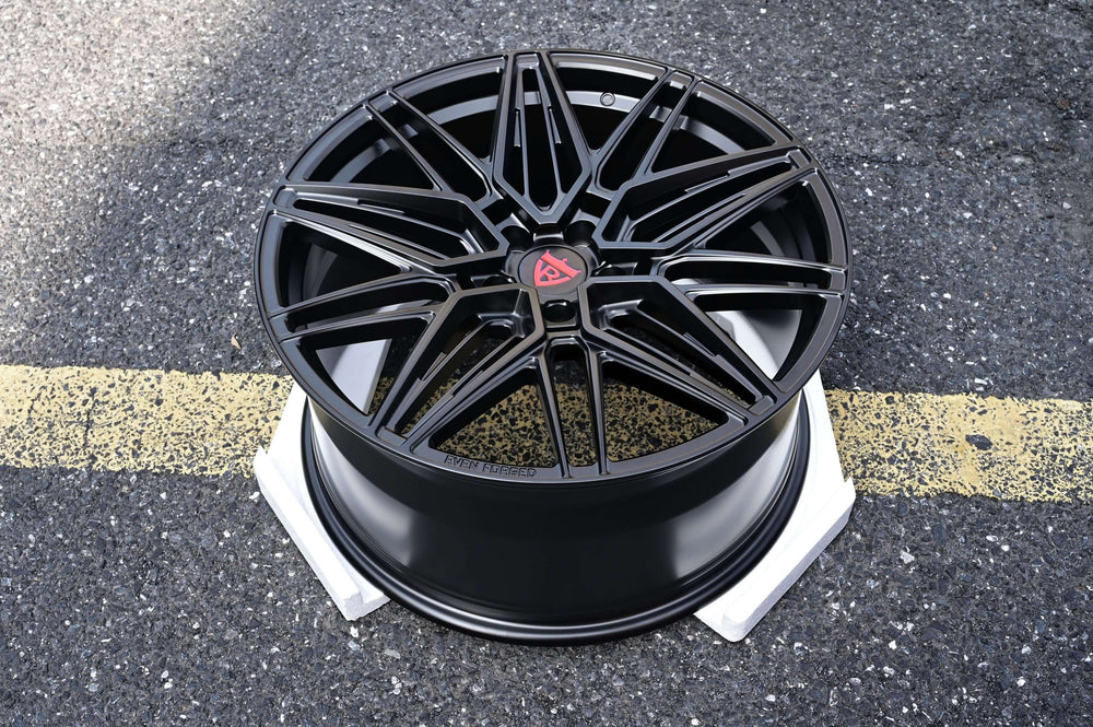 Black custom forged monoblock rim for Tesla Model Y, featuring a sleek design and 21-inch staggered fitment.