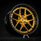 Custom dark gold and black deep dish wheel for Tesla Model S Plaid with 21-inch staggered rim design against a black background.