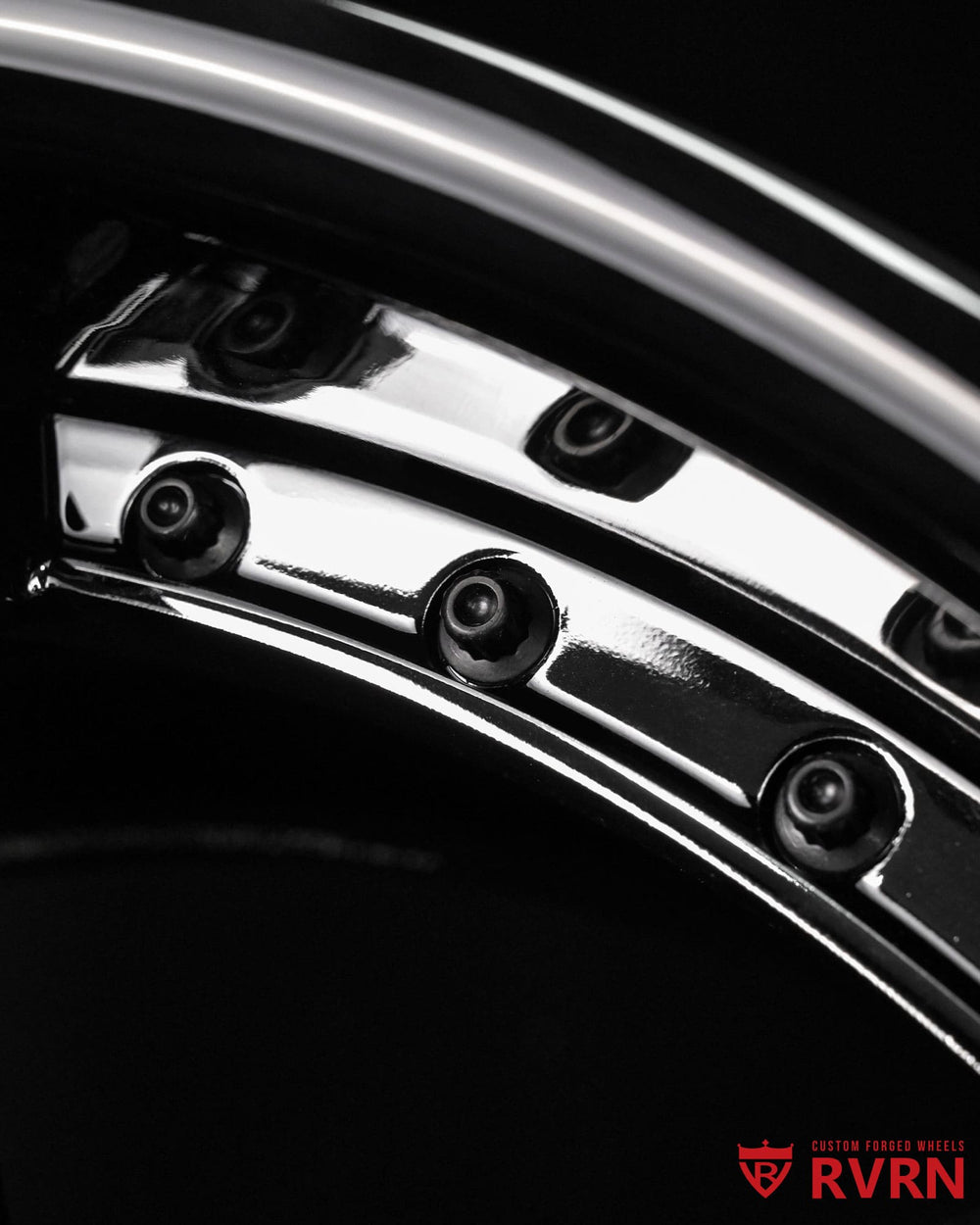 Detailed shot of custom Escalade V forged wheels in 19x9.5 front and 20x11 rear specifications with premium black chrome finish