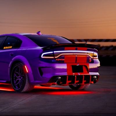 Purple Dodge Charger with black accents and custom 22-inch deep dish RVRN forged wheels, showcasing vibrant lighting.
