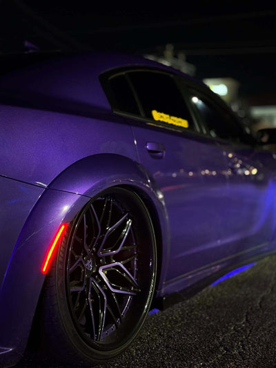 Dodge Charger Widebody featuring custom forged purple and black wheels with deep dish rims at night.
