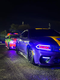 Dodge Charger Widebody with purple and black wheels, featuring deep dish custom forged rims, parked at night.