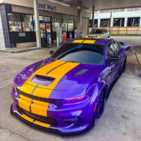 Dodge Charger Widebody with purple and yellow stripes, featuring custom forged deep dish rims and black wheels.