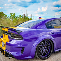 Dodge Charger Widebody in purple with black deep dish rims and custom forged wheels, showcasing a striking design.