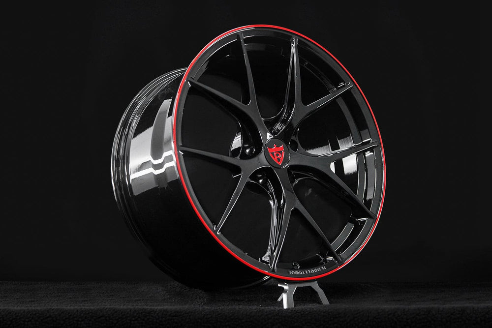 Premium finish detail of RVRN RV-MR05 Corvette C8 forged wheels highlighting the Gloss Black coating and vivid Gloss Red trim.