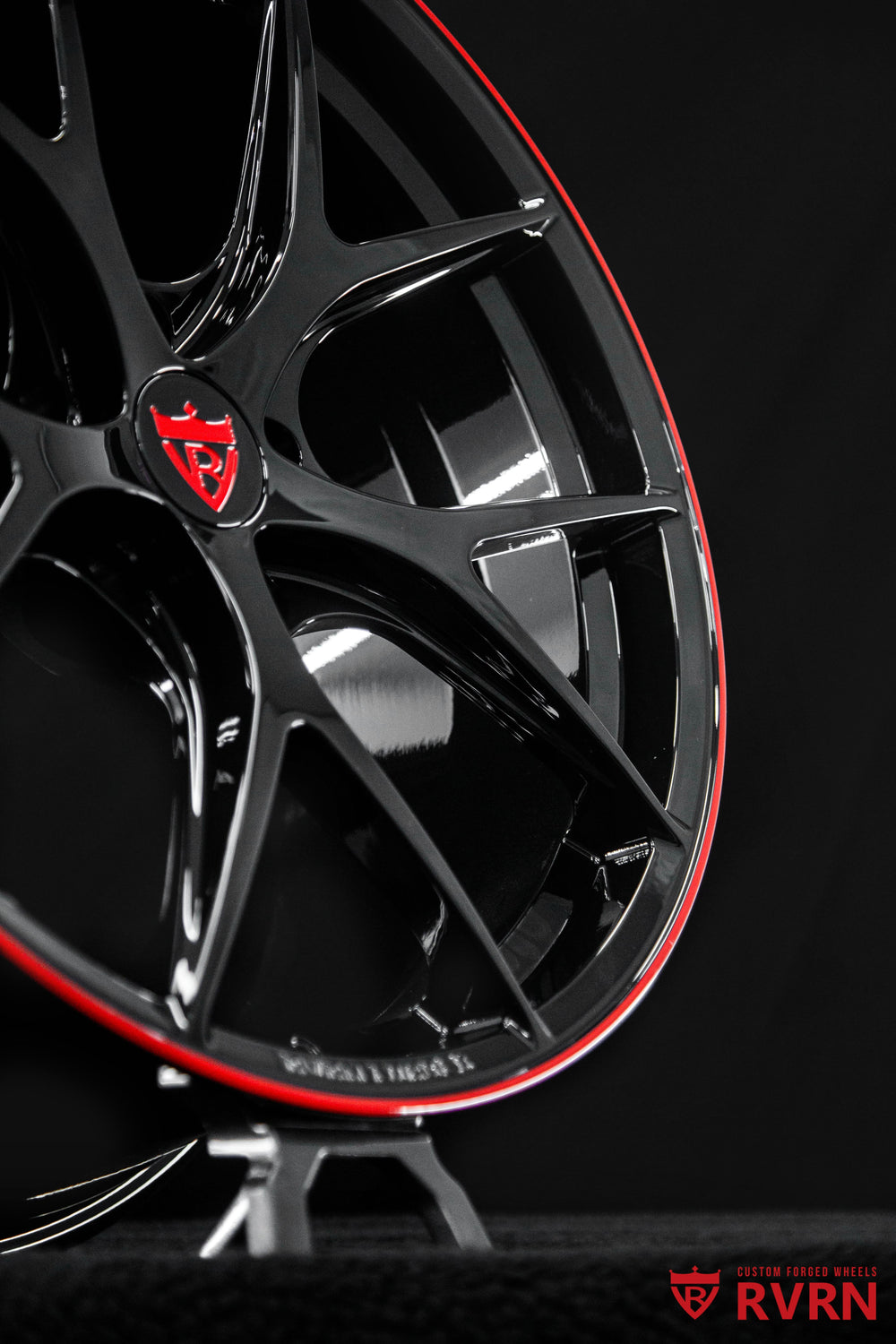 Front three-quarter view of a 2024 Corvette C8 Z06 on RVRN RV-MR05 Y-spoke Corvette C8 wheels in Gloss Black and Gloss Red, custom forged 20x10 +27 front and 21x13 +27 rear flush fitment.