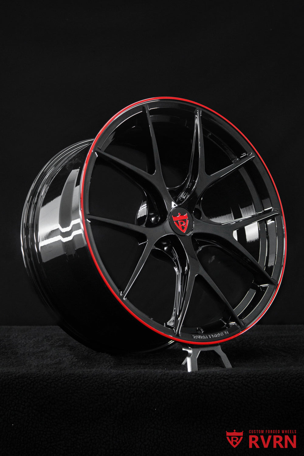 Detailed wheel face of the RVRN RV-MR05 Corvette aftermarket wheels with Gloss Black finish, Gloss Red accent and lightweight forged monoblock construction.