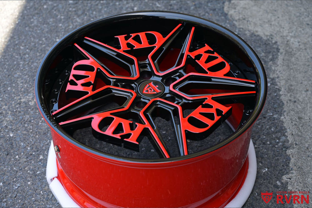 Close-up of RB-01 forged wheel spokes in black and red