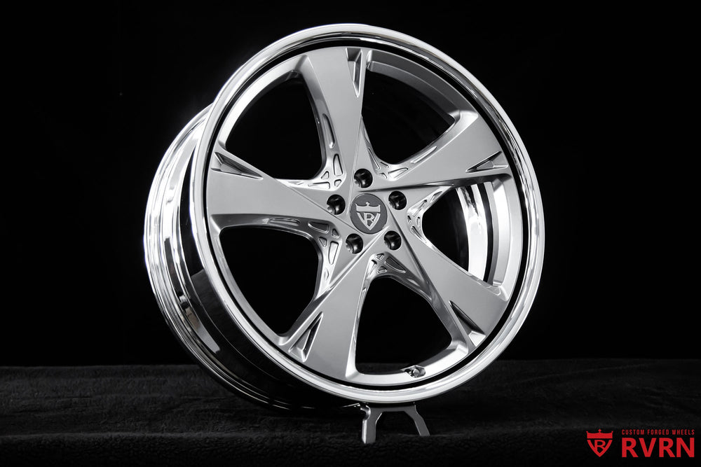 Front three-quarter view of 2024 Genesis GV80 on RVRN RV-DG01 2-piece forged wheels with chrome barrel and gunmetal 5-spoke design, custom 22x9.5 +35MM fitment.