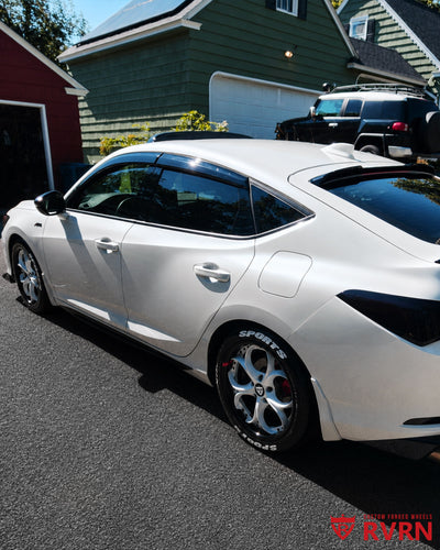 Rear side view of a 2024 Acura Integra A-Spec Tech featuring RV-DS016 pearl white and gloss black custom forged wheels.
