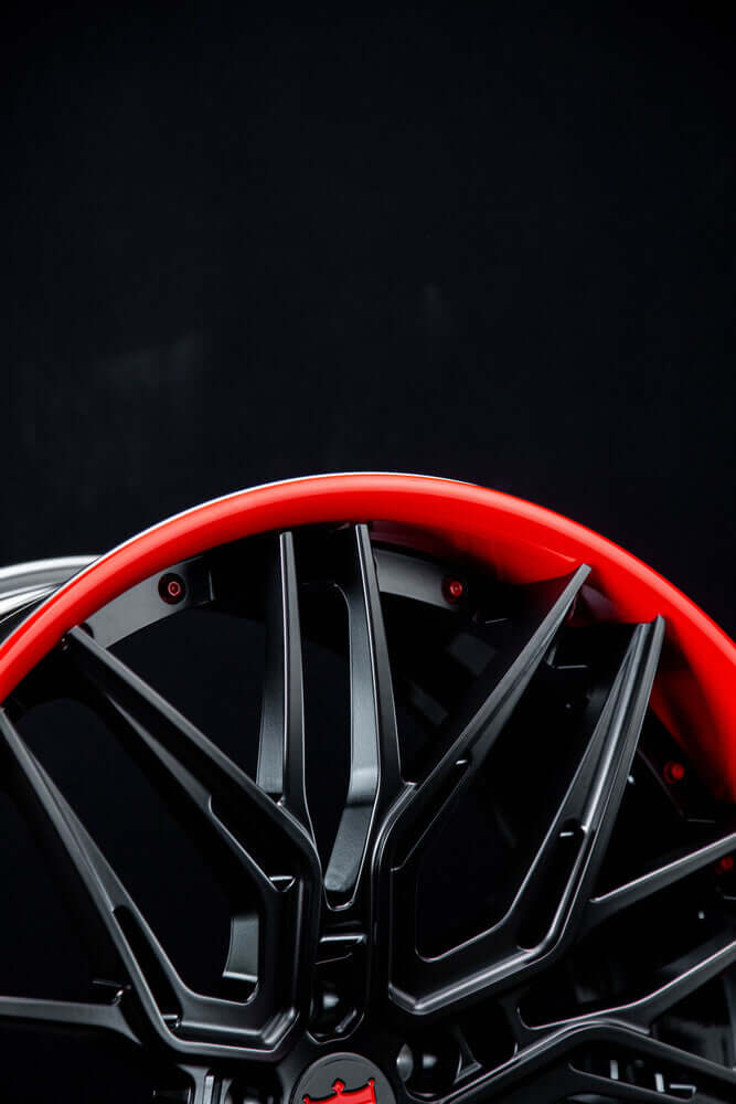 Gloss black and red forged wheel with chrome bolts