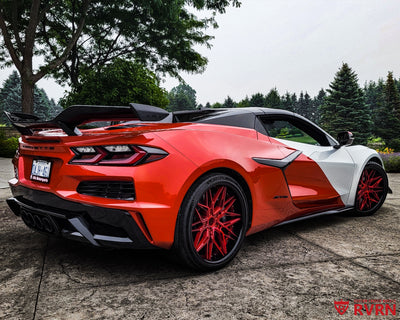 2024 Chevrolet Corvette C8 Z06 on RVRN RV-T081 2-piece deep dish custom forged wheels in Brushed Crystal Burgundy Spoke with Gloss Black Barrel, rear three-quarter view showing the carbon ceramic brakes and 21x13 rear fitment.