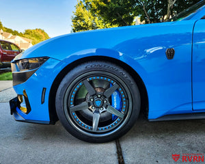 Front wheel close-up on a 2024 Ford Mustang Dark Horse running an RVRN RV-DF14 2-piece forged wheel in gloss gunmetal with blue rim screws.