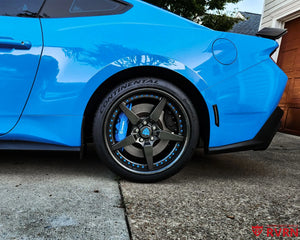 Rear wheel detail on a 2024 Ford Mustang Dark Horse with the RVRN RV-DF14 gloss gunmetal forged wheel and blue hardware.