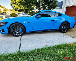 2024 Ford Mustang Dark Horse in blue on RVRN RV-DF14 gloss gunmetal 2-piece forged wheels, side view.