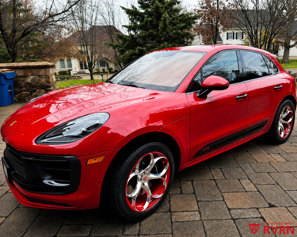 2024 Porsche Macan GTS on RVRN RV-MS016 monoblock custom forged wheels in Polished Aluminum Spoke with color matched Carmine Red Barrel, front three-quarter view on the driveway.