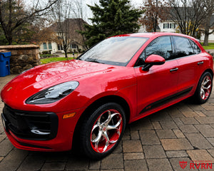 2024 Porsche Macan GTS on RVRN RV-MS016 monoblock custom forged wheels in Polished Aluminum Spoke with color matched Carmine Red Barrel, front three-quarter view on the driveway.