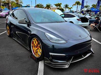 Front three-quarter view of a 2024 Tesla Model Y Performance on RVRN RV-DR08 Y-spoke custom forged wheels in transparent dark gold with polished aluminum lips, 21x9.5 and 21x10.5.