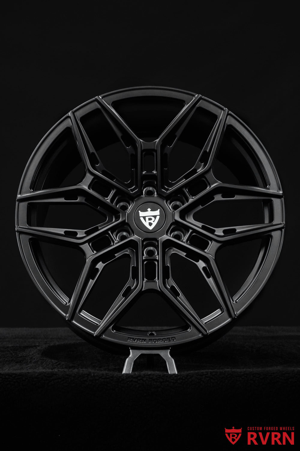 Detail shot of RVRN RV-MR616 stain black Cadillac forged wheels showing precision-machined one-piece construction and custom design details.