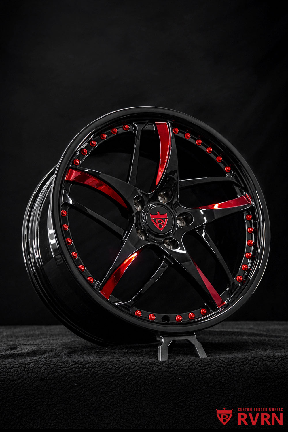 Three-quarter view of a 2025 Corvette C8 Stingray equipped with custom RV-MC36 forged wheels in black and red finish with vehicle-specific fitment