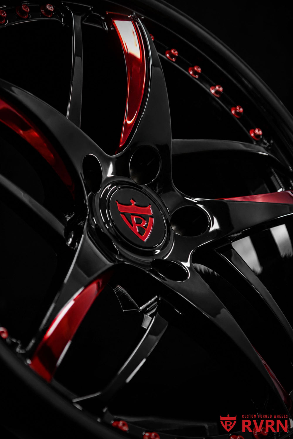 Front face view of RVRN RV-MC36 one-piece forged wheels designed for Corvette C8 Stingray in gloss black and red mist finish