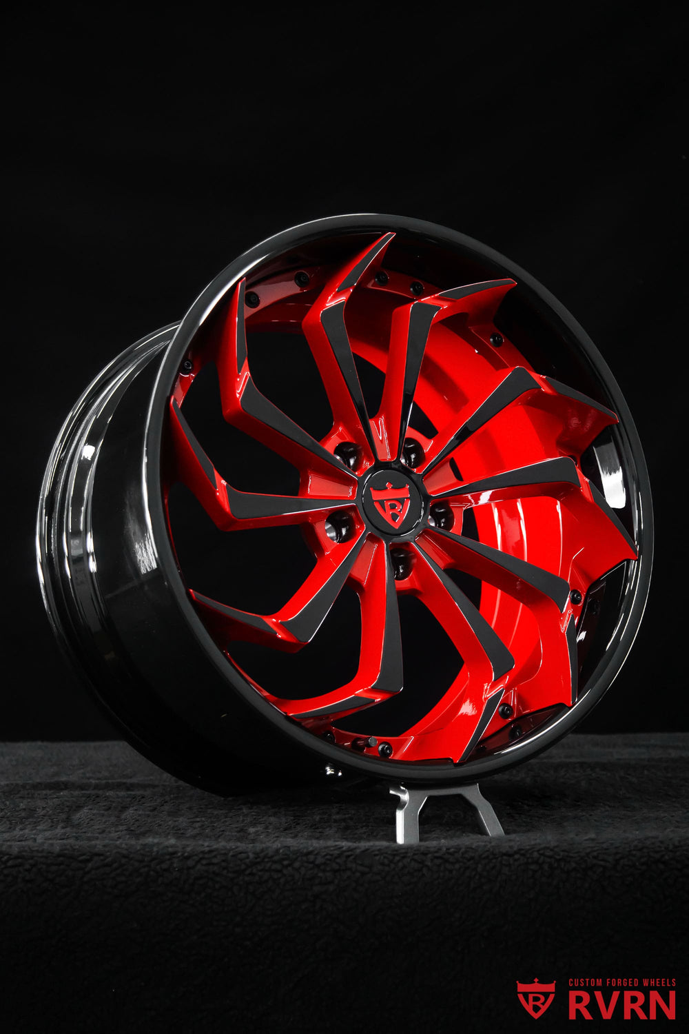 Close-up detail of RVRN RV-DC06 Corvette C8 forged wheels showing black and red spoke design, black screws, and precision 19x8.5 front wheel construction.