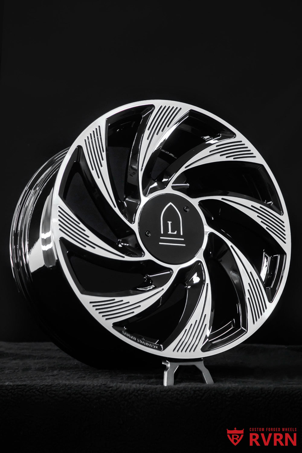 Front three-quarter view of Tesla Model Y forged wheels featuring the RV-MY01 one-piece forged directional design in gloss black with machined face, 20x9.5 +30 fitment.