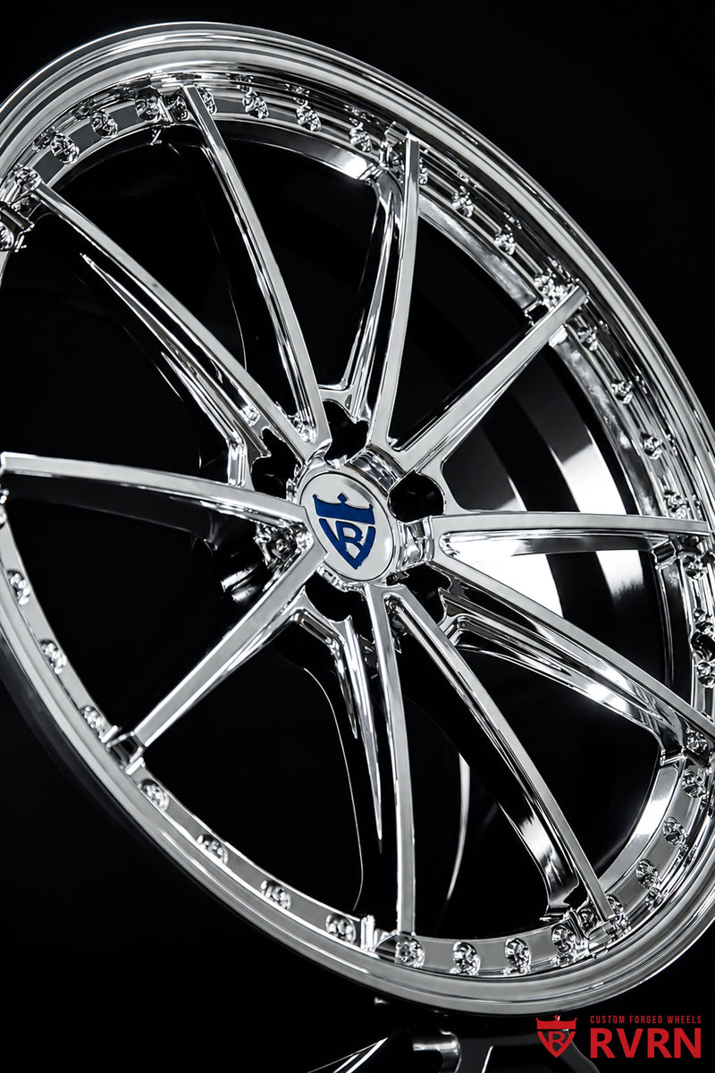 Front three-quarter view of a 2026 Tesla Model Y Performance on RVRN RV-MY26 custom forged wheels in an all chrome finish, 21x9.5 front and 21x10.5 rear with OEM brake fitment.