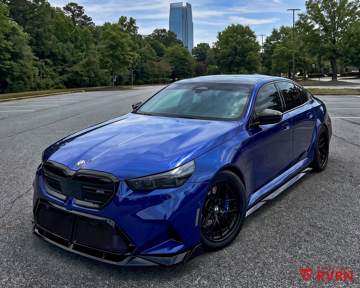 Front three-quarter view of a 2026 BMW M5 G90 on RVRN RV-DR08D Y-spoke deep dish custom forged wheels in all gloss black, 20x10.5 front and 21x11 rear.
