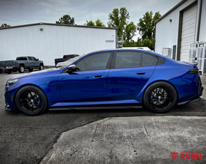 Side profile of a 2026 BMW M5 G90 fitted with RVRN RV-DR08D Y-spoke deep dish gloss black custom forged wheels.