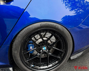Wheel close-up on a 2026 BMW M5 G90 with RVRN RV-DR08D Y-spoke deep dish custom forged wheels in gloss black and crystal blue engravings.