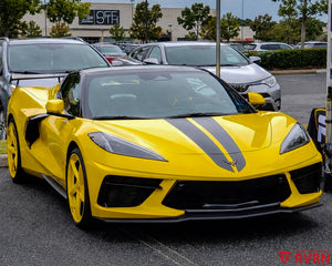 2026 Corvette C8 Stingray on RVRN RV-MC35 5-spoke custom forged wheels in Competition Yellow with Gloss Black Barrel, front three-quarter view at the Saks Fifth Avenue parking lot.