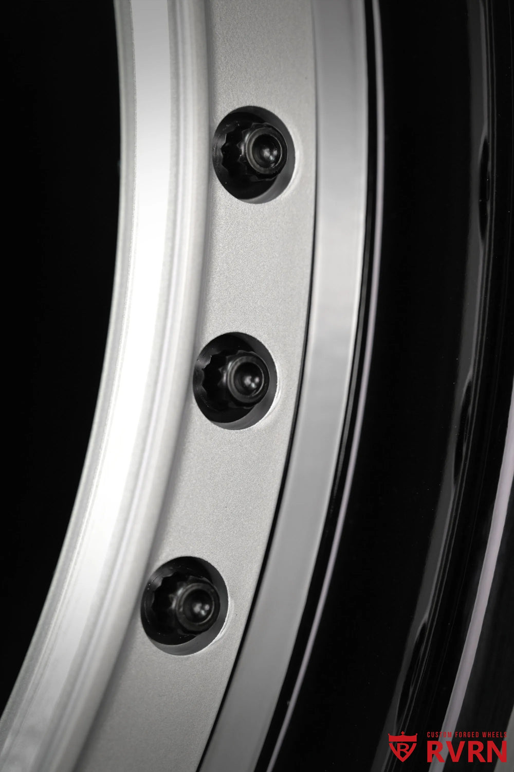 Close-up of an RV-DR08D 2-piece forged wheel for the 2026 Corvette C8 Stingray, showing the silver spoke finish, black fasteners, and glossy black barrel edge in a detailed product view