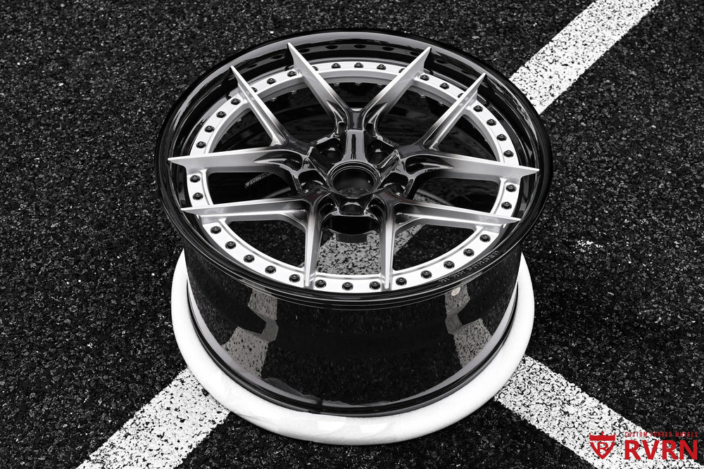 RV-DR08D 2-piece forged wheel for the 2026 Corvette C8 Stingray shown from an outdoor top view, highlighting the silver Y Spokes, black center, stepped lip, and Gloss Black Barrel finish