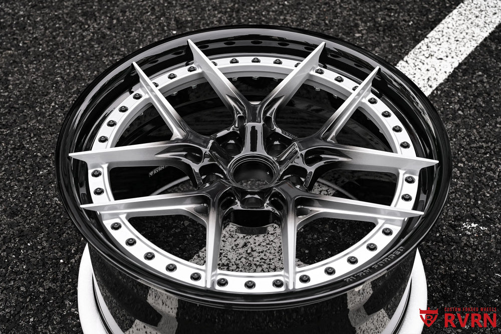 RV-DR08D 2-piece forged wheel for the 2026 Corvette C8 Stingray shown in a close front view, with sharp Y Spoke lines, silver spoke faces, black center details, and a gloss black barrel