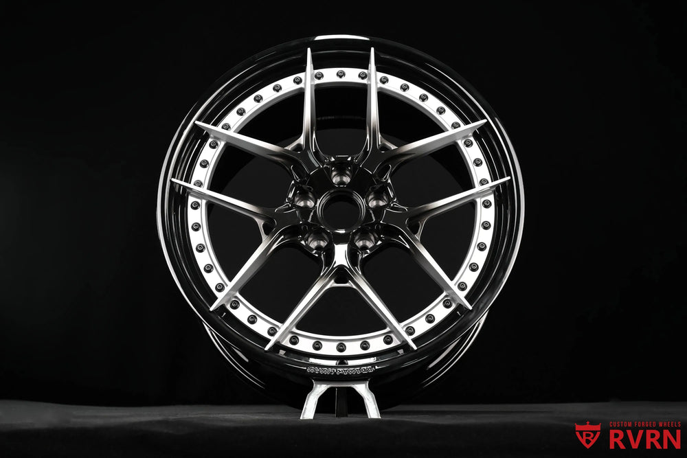 Front view of an RV-DR08D 2-piece forged wheel for the 2026 Corvette C8 Stingray, showing the symmetrical Y Spoke layout, silver spoke faces, black center section, and Gloss Black Barrel