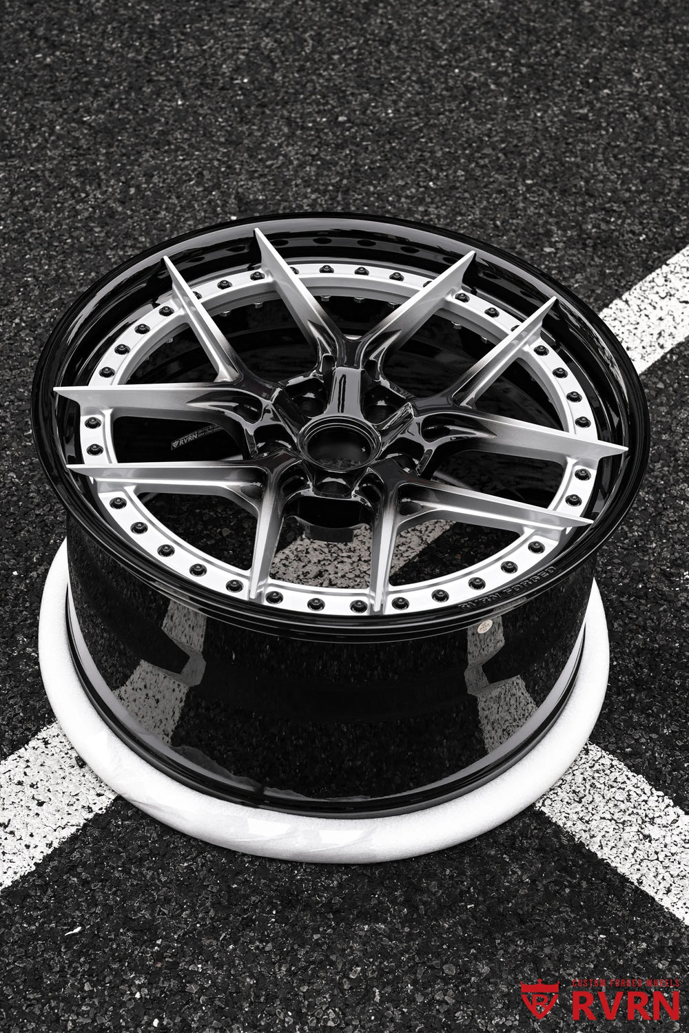 Angled outdoor view of an RV-DR08D 2-piece forged wheel for the 2026 Corvette C8 Stingray, showing the deep barrel profile, silver Y Spokes, black center, and stepped outer lip