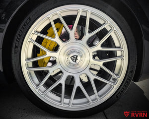 Close-up of the RVRN RV-MC26 brushed aluminum one-piece forged wheel and gold RVRN center cap on a 2026 Corvette C8 ZR1.