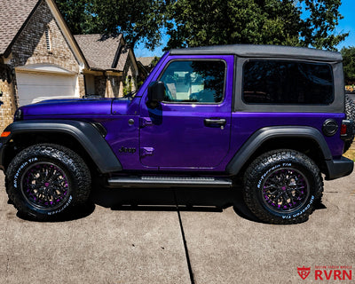 2026 Jeep Wrangler on RVRN RV-T081 2-piece deep dish custom forged wheels, Gloss Black spokes with Grape Purple accents, side profile view in a suburban driveway.
