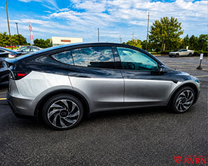 2026 Tesla Model Y Juniper with RVRN RV-MY01 gloss black and machined face custom forged wheels, rear three-quarter view in a parking lot.