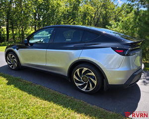 Two-tone 2026 Tesla Model Y Juniper on RVRN RV-MY01 custom forged wheels in Gloss Black with Machined Face finish, rear three-quarter view with rear spoiler.