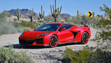 Red Corvette with custom forged 2-piece wheels on desert road with mountain and cactus backdrop