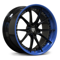 A multi-spoke alloy wheel rim with a glossy black face and a vibrant blue outer lip, shown at a three-quarter angle on a white background.