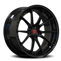 Black alloy wheel with a visible brand logo on a white background